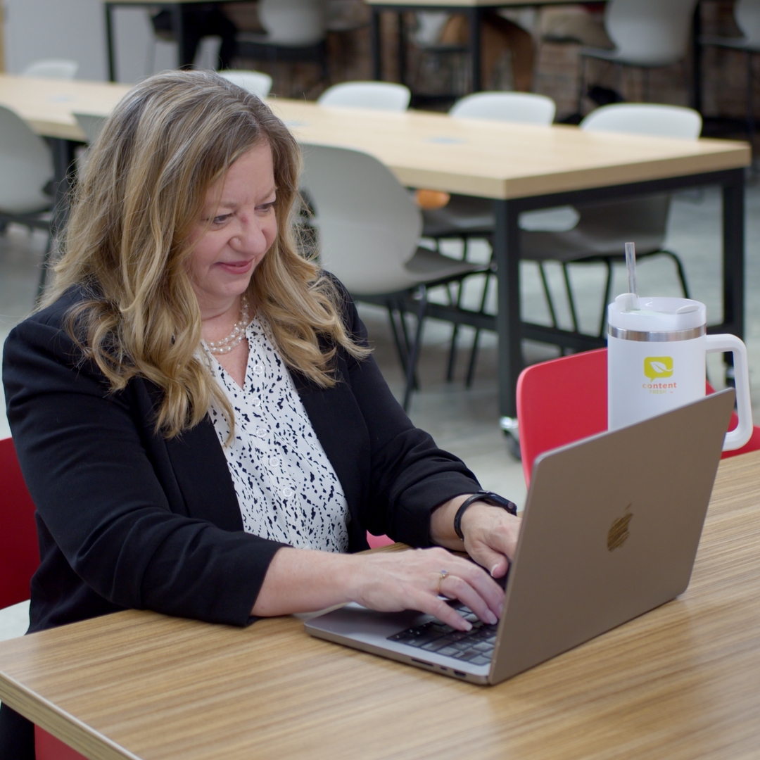 social media manager working on laptop